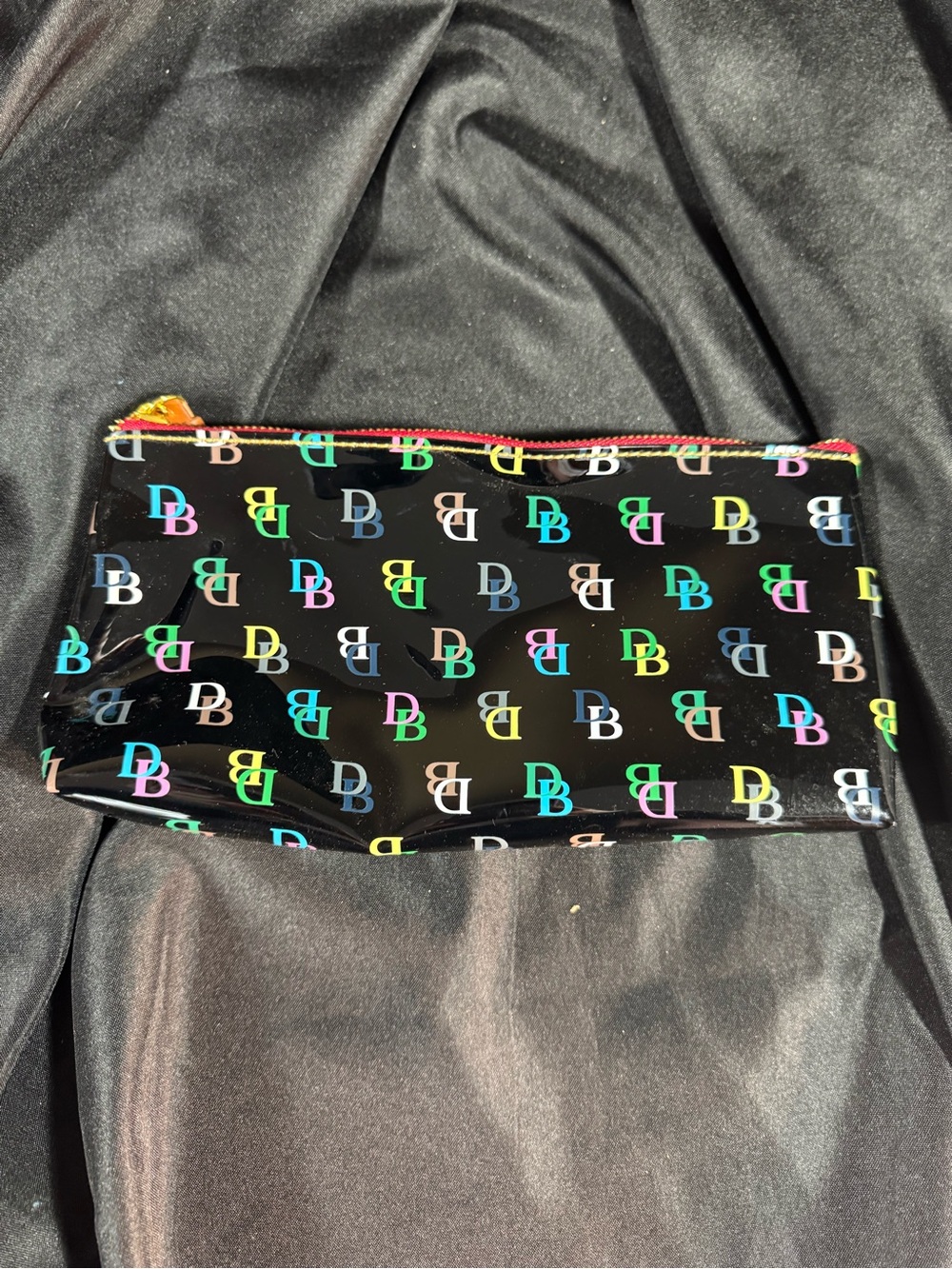 Dooney & Bourke Black Glossy Zip Pouch with Multicolor DB Logos